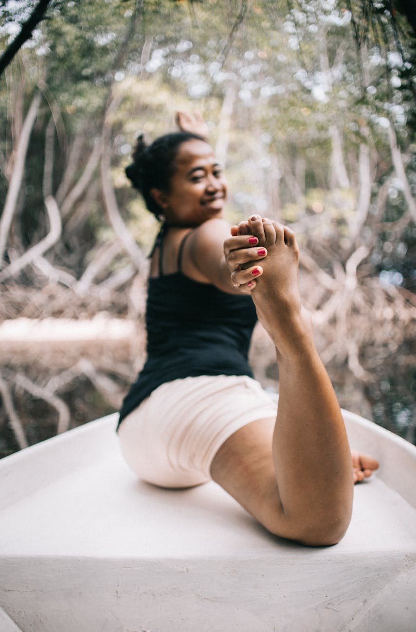 photo of woman stretching her body